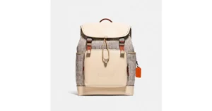 COACH Leather League Flap Backpack In Signature Jacquard in Black Copper/Stone/Ivory