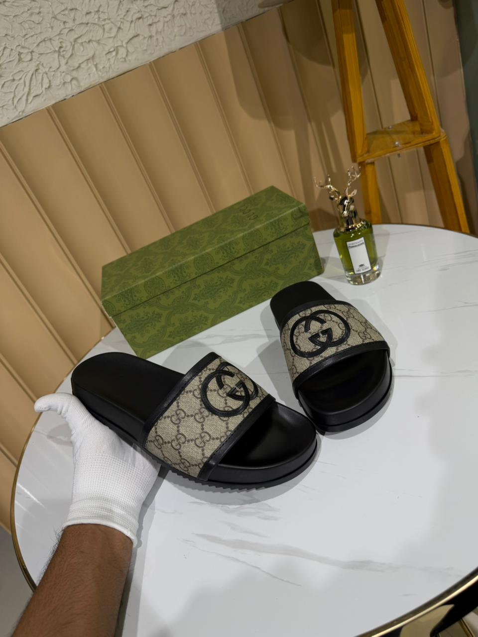 Gucci slides featuring the brand's iconic GG monogram canvas. - Image 4