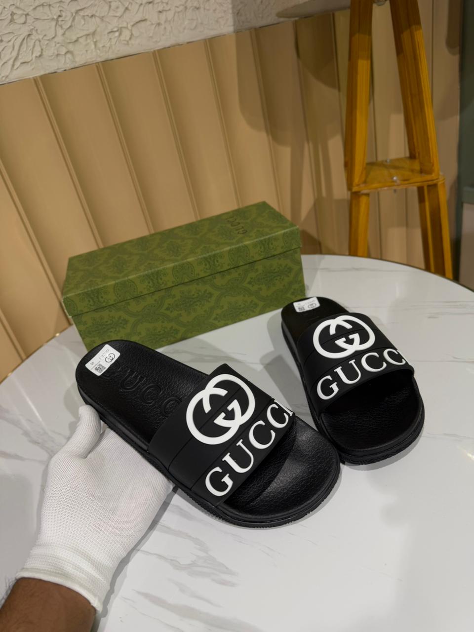Gucci black slides, specifically featuring the iconic Interlocking G logo. - Image 3