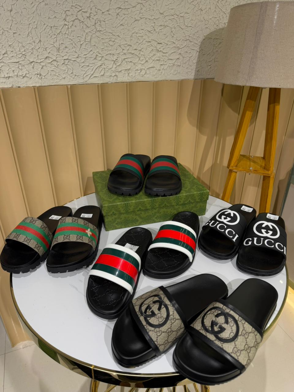 Gucci black slides, specifically featuring the iconic Interlocking G logo. - Image 5