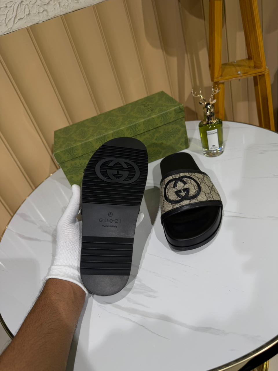Gucci slides featuring the brand's iconic GG monogram canvas. - Image 2
